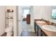 Bathroom featuring double sinks and a connected toilet area at 6906 Glenbrook Dr, Lakeland, FL 33811