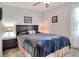 Inviting bedroom with a dark wooden headboard and neutral color scheme at 6906 Glenbrook Dr, Lakeland, FL 33811