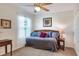 Bedroom with daybed with blue and red pillows and neutral walls and carpet at 6906 Glenbrook Dr, Lakeland, FL 33811