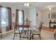 Inviting dining area featuring a glass-top table, comfortable seating, and stylish decor at 6906 Glenbrook Dr, Lakeland, FL 33811