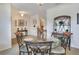 Formal dining room featuring a glass-top table, elegant decor, and ample natural light at 6906 Glenbrook Dr, Lakeland, FL 33811