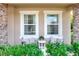 Cozy front porch featuring chairs, decorative pillows, and stone pillar accents at 6906 Glenbrook Dr, Lakeland, FL 33811