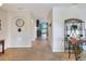 Inviting hallway with neutral tones, arched doorways, and stylish decorative shelving at 6906 Glenbrook Dr, Lakeland, FL 33811