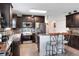 Stylish kitchen with dark cabinetry, stainless steel appliances, and a functional center island at 6906 Glenbrook Dr, Lakeland, FL 33811