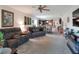 Spacious living area with a comfortable seating arrangement, open to the modern kitchen at 6906 Glenbrook Dr, Lakeland, FL 33811