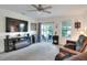 Inviting living room with a fireplace and sliding glass door leading to the outdoors at 6906 Glenbrook Dr, Lakeland, FL 33811