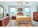Cozy main bedroom featuring natural light and neutral tones throughout at 6906 Glenbrook Dr, Lakeland, FL 33811