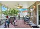 Enclosed lanai offering outdoor seating with view to yard and fence at 6906 Glenbrook Dr, Lakeland, FL 33811