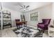 Cozy bedroom featuring stylish decor, an accent rug, and a bright, sunny window at 7921 Sebago Ct, Orlando, FL 32835