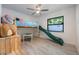 A playful loft bed with a slide provides fun and functionality in this room at 7921 Sebago Ct, Orlando, FL 32835