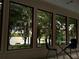 Breakfast nook with table, chairs, and a wall of windows overlooking a scenic water view at 7921 Sebago Ct, Orlando, FL 32835