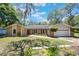 Charming single Gathering home with brick and siding, featuring a well-maintained front yard and attached garage at 7921 Sebago Ct, Orlando, FL 32835