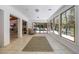 Bright living area featuring large windows, tile floors, and a glimpse of the home's open layout at 7921 Sebago Ct, Orlando, FL 32835