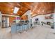 Open floor plan featuring a kitchen with stainless steel appliances and a large island at 7921 Sebago Ct, Orlando, FL 32835
