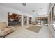 Spacious living room with tile floors, skylights, and an open floor plan leading to the kitchen and outdoor patio at 7921 Sebago Ct, Orlando, FL 32835