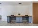 Functional home office space featuring custom built-ins, a spacious countertop, and stylish seating for comfortable work at 7921 Sebago Ct, Orlando, FL 32835