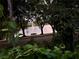 Scenic water view with water fountain through the trees with bench nearby to relax at 7921 Sebago Ct, Orlando, FL 32835