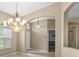 Bright dining area features a chandelier, neutral walls, and window with natural light at 9413 Ivywood St, Clermont, FL 34711