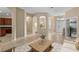 Inviting entryway with arched doorways, tile flooring, and views of the dining area and front door at 9413 Ivywood St, Clermont, FL 34711