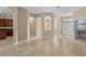 Open floor plan features neutral walls, tile flooring, and archways leading to other rooms at 9413 Ivywood St, Clermont, FL 34711