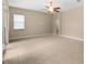 The living area features tile floors, light colored walls, and sliding doors to the patio at 9413 Ivywood St, Clermont, FL 34711