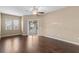 This living room has hardwood floors and sliding glass doors leading to an outdoor space at 9413 Ivywood St, Clermont, FL 34711