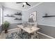Home office featuring a modern desk, shelving, neutral colors, and a bright window at 9413 Ivywood St, Clermont, FL 34711