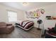 Quirky bedroom with modern decor, graffiti art and an armchair at 999 W Juniata St, Clermont, FL 34711