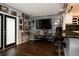 Modern living room featuring an accent wall, tv and bar area with a unique design at 999 W Juniata St, Clermont, FL 34711