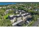 An aerial view highlights this condo community's roof, landscaping, and covered parking at 101 N Grandview St # 103, Mount Dora, FL 32757