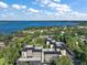 An aerial view of the condos reveals proximity to the water and surrounding tree-lined neighborhood at 101 N Grandview St # 103, Mount Dora, FL 32757