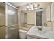 Neutral colored bathroom with walk-in shower, mirrored wall, and a single sink vanity at 101 N Grandview St # 103, Mount Dora, FL 32757