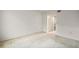 Empty bedroom with neutral carpet and a closet with bi-fold doors at 101 N Grandview St # 103, Mount Dora, FL 32757
