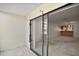 View from patio into a living room with carpet and bar area at 101 N Grandview St # 103, Mount Dora, FL 32757