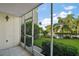 Screened in patio with view of manicured lawn and pool at 101 N Grandview St # 103, Mount Dora, FL 32757