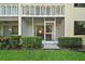 Exterior of the building with patio and manicured lawn in front at 101 N Grandview St # 103, Mount Dora, FL 32757