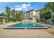 Enjoy this beautiful community pool with ample seating and lush landscaping at this lovely condominium complex at 101 N Grandview St # 103, Mount Dora, FL 32757
