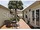 Private backyard featuring an accent table and seating at 1041 Reidville Rd, The Villages, FL 32162