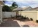 Private backyard with patio furniture and accent landscaping at 1041 Reidville Rd, The Villages, FL 32162