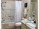 Bright bathroom featuring a shower-tub combo at 1041 Reidville Rd, The Villages, FL 32162