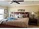 Cozy bedroom featuring neutral tones, a ceiling fan and a large bed at 1041 Reidville Rd, The Villages, FL 32162
