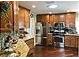 Wood cabinets and stainless appliances accent this kitchen's appeal for the cooking enthusiast at 1041 Reidville Rd, The Villages, FL 32162