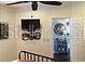 Comfortable living room includes ceiling fan and wall-mounted TV at 1041 Reidville Rd, The Villages, FL 32162