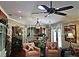 An inviting living room with cozy seating arrangements and ample lighting fixtures at 1041 Reidville Rd, The Villages, FL 32162