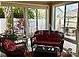 Bright sun room with large windows, comfortable seating and an accent table at 1041 Reidville Rd, The Villages, FL 32162