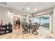 Bright dining area featuring tile floors, sliding glass doors and neutral decor at 1065 Berg Ct, The Villages, FL 32162