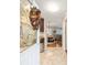 Inviting foyer with a decorative glass door, tile flooring, and views of the dining room and living areas at 1065 Berg Ct, The Villages, FL 32162