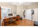 Bright home office with hard floors, closet and doorway partial view to kitchen at 1065 Berg Ct, The Villages, FL 32162