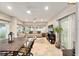 Inviting lanai with comfortable seating, a ceiling fan, and views of the backyard at 1065 Berg Ct, The Villages, FL 32162