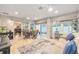 Bright open floor plan featuring a seating area and a dining table at 1065 Berg Ct, The Villages, FL 32162